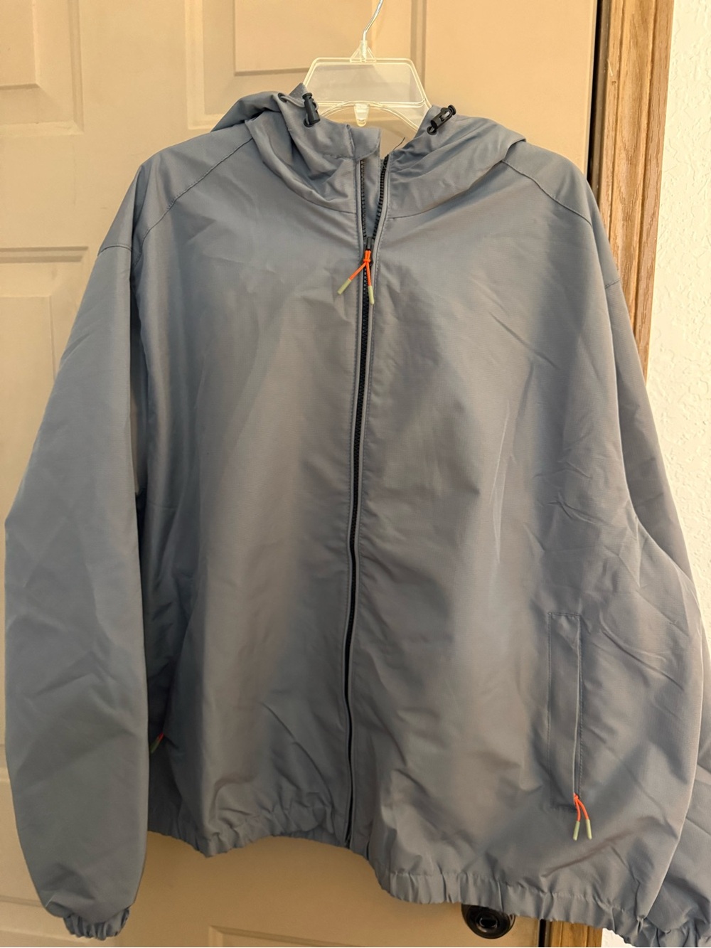 Ozark Trail Light Blue Hooded Windbreaker with Orange Accents